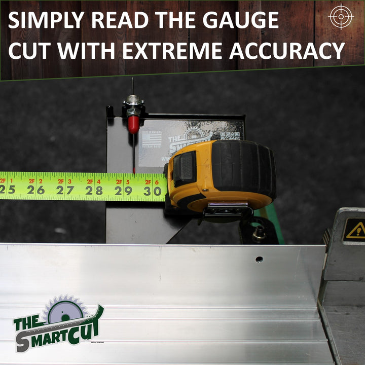 A close‑up of The Smart Cut measuring attachment clamped to an aluminum fence, showing a tape measure inserted into its gauge with the red pointer aligned at 30 inches