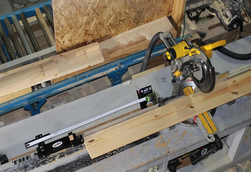 photo of a miter saw tool that cuts a wooden board